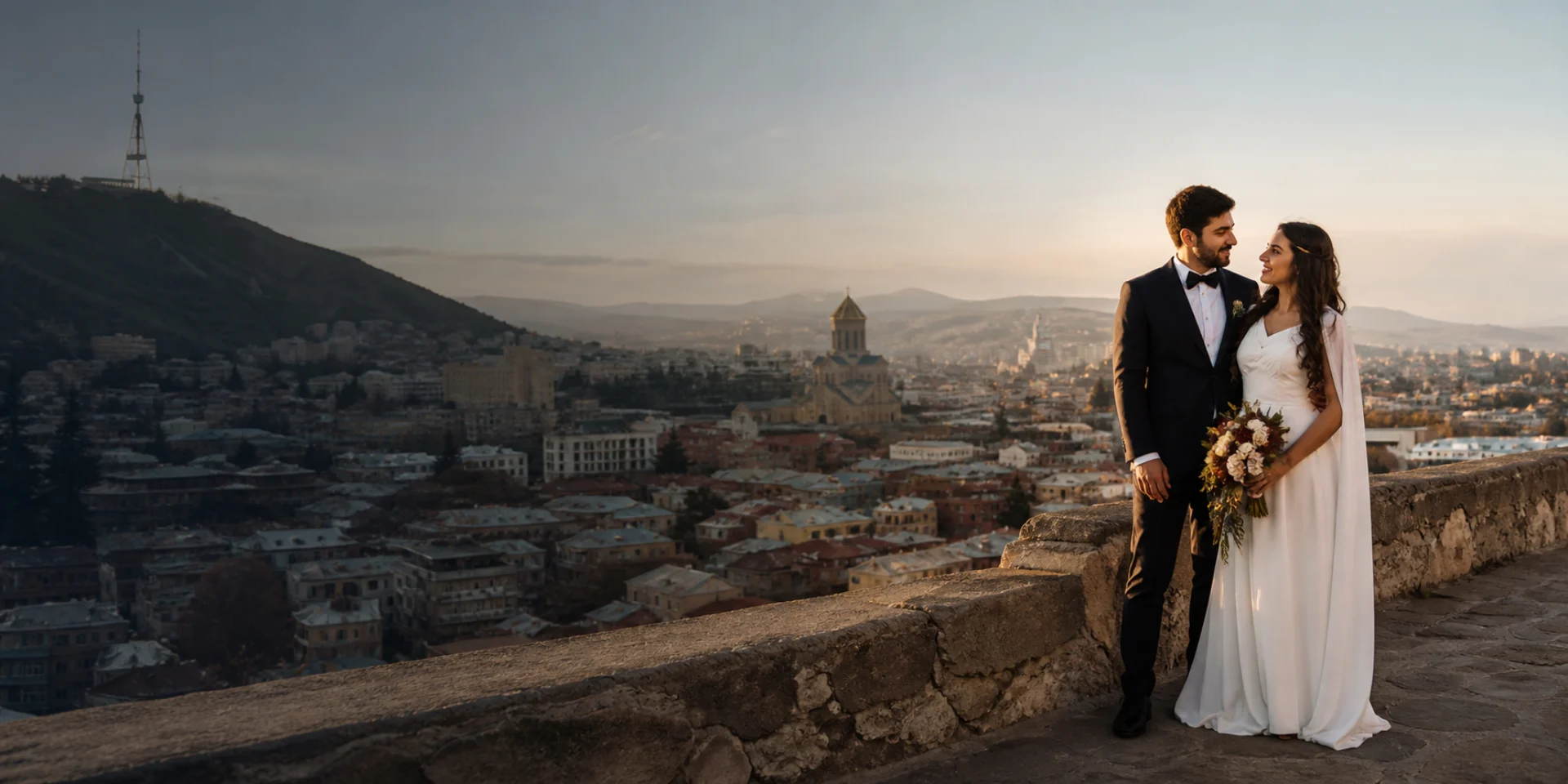 Newly married couple overlooking Tbilisi